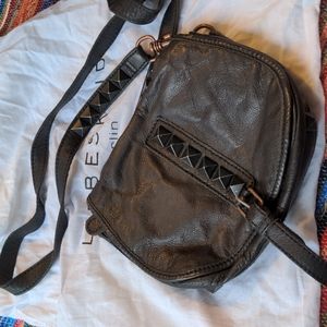 Black studded leather bag